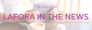 This is a faded photo of a desk. Somebody has a mug of coffee and it holding their tablet while sitting at the table. Over the picture is text that reads "Lafora In The News." Above that is the Chelsea's Hope Lafora Children Research Fund logo.