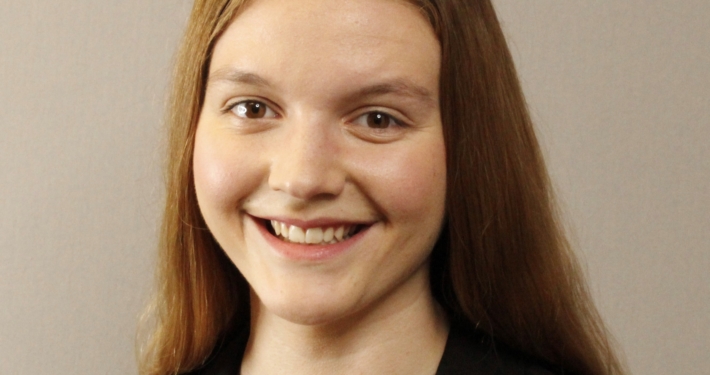Headshot of Meredith Williams in business dress, smiling.