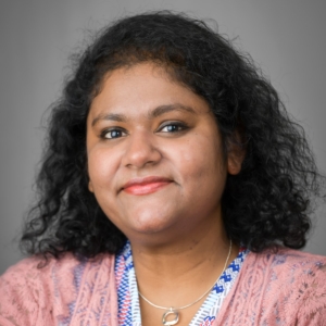 Headshot of Dr. Sharmistha Mitra smiling