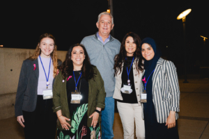 Five members of the Chelsea's Hope Board of Directors smiling and standing together.