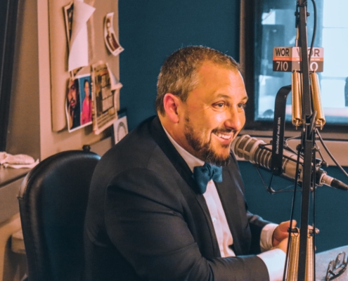 Dr. Sean Hall speaking into a microphone