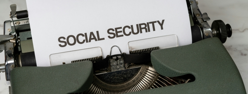 text says "social security" on a piece of paper in a typewriter